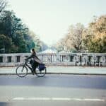 cyclist-on-river-bridge